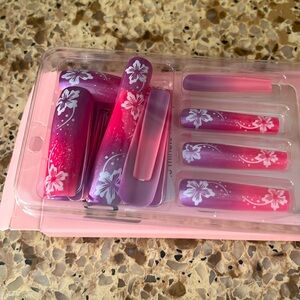 Beautiful fake nails decorated with beautiful flowers